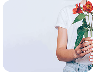 girl on a white background holding flowers in her hands