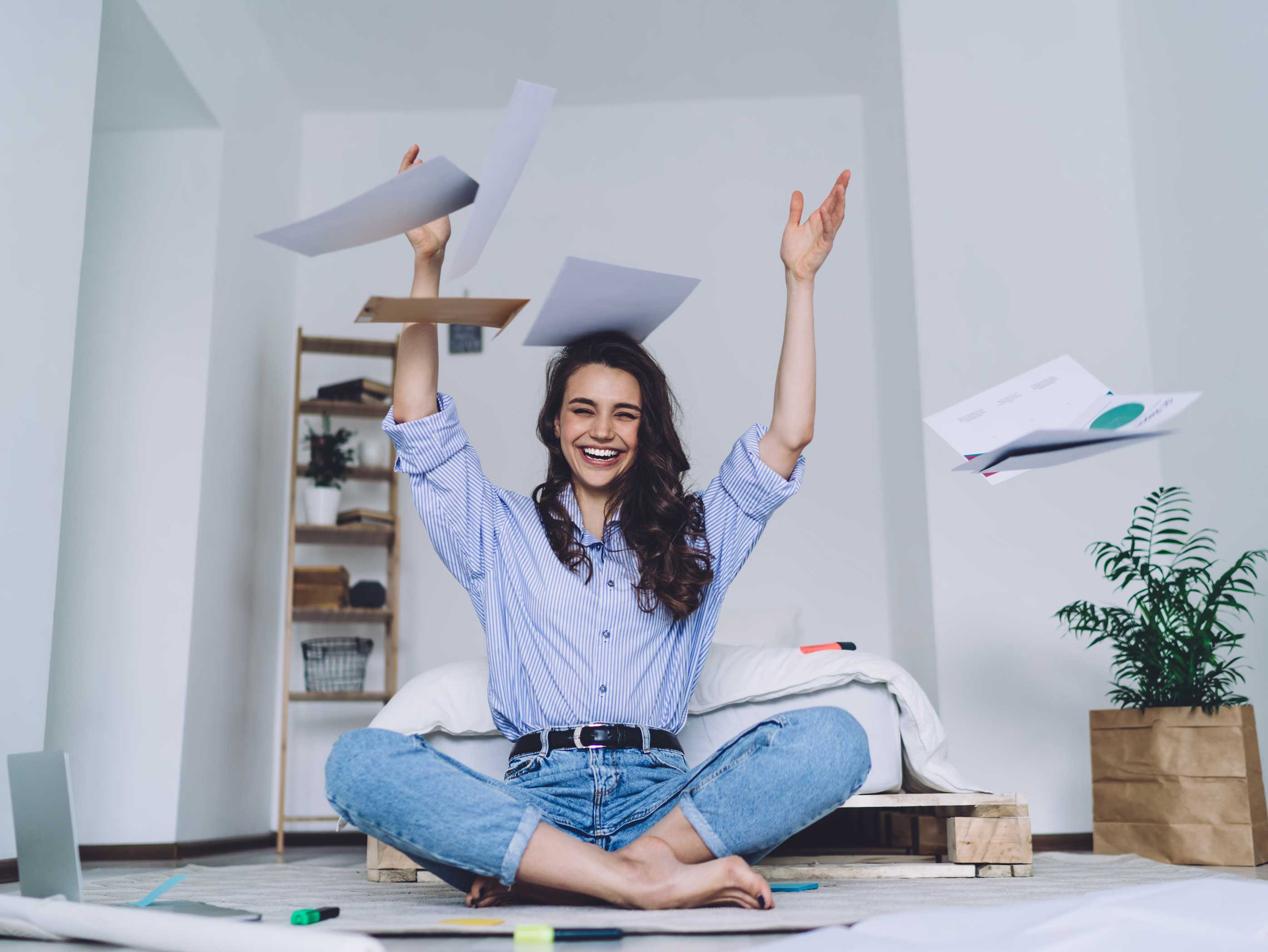 woman throwing stock papers