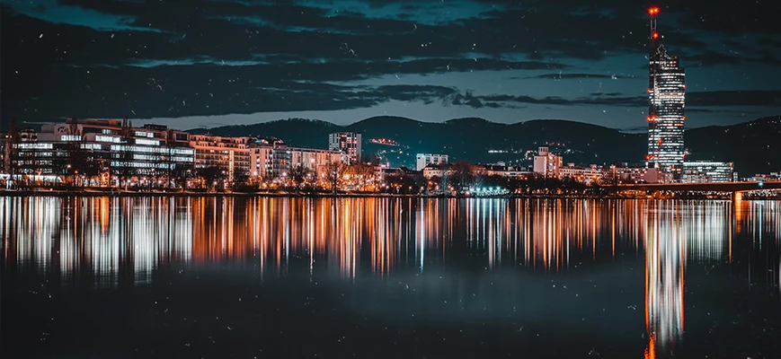 city lights reflecting at night over the water
